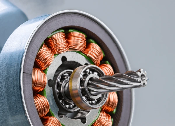 Close up view of electric motor rotor with precision coil winding copper for efficient operation Close up view of electric motor rotor with precision coil winding copper for efficient operation