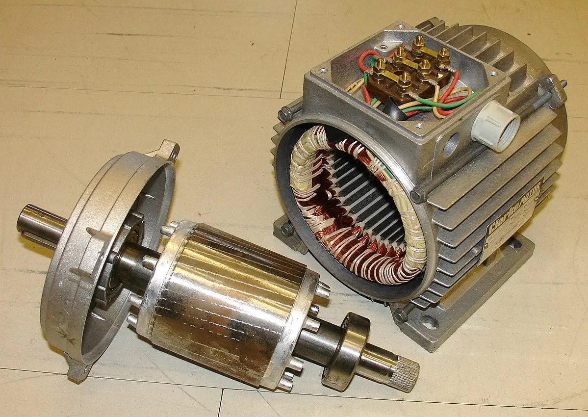 Disassembled motor showing stator with windings and rotor components
