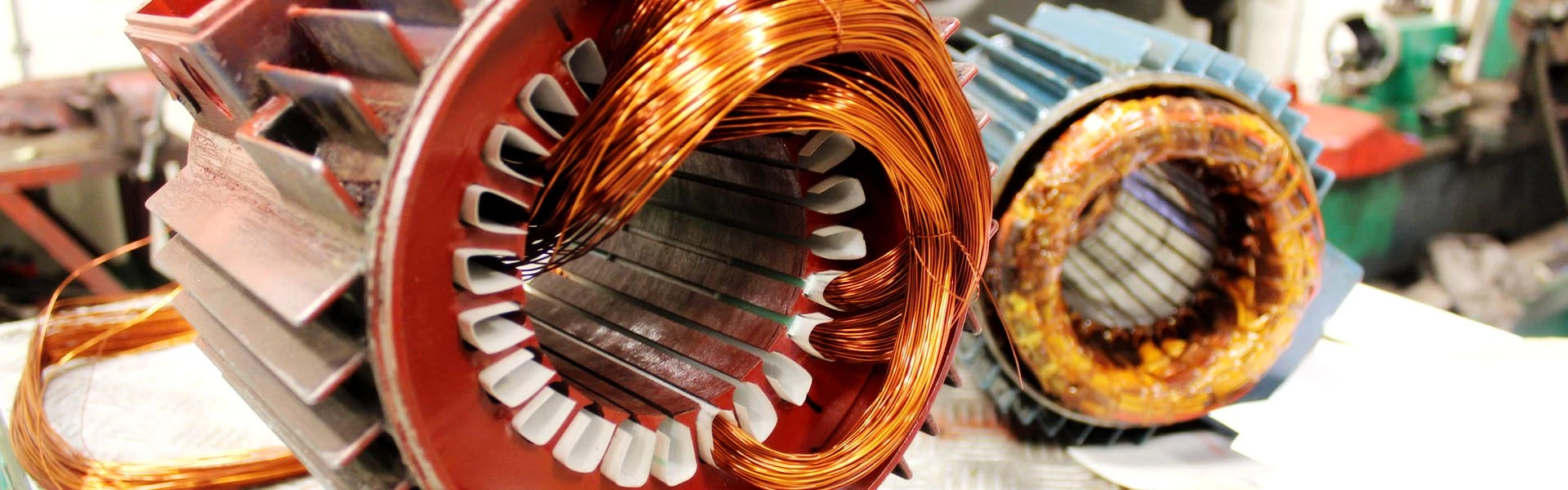 A motor stator being wound with copper wire on an assembly line