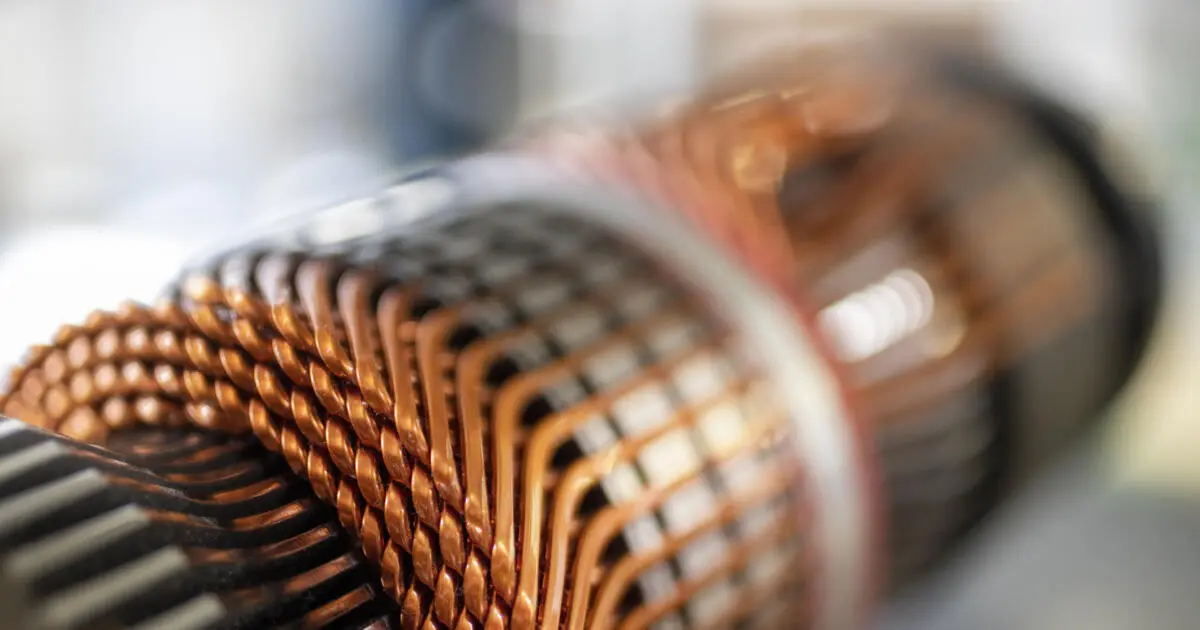 Close up of copper wire wound around an industrial motor