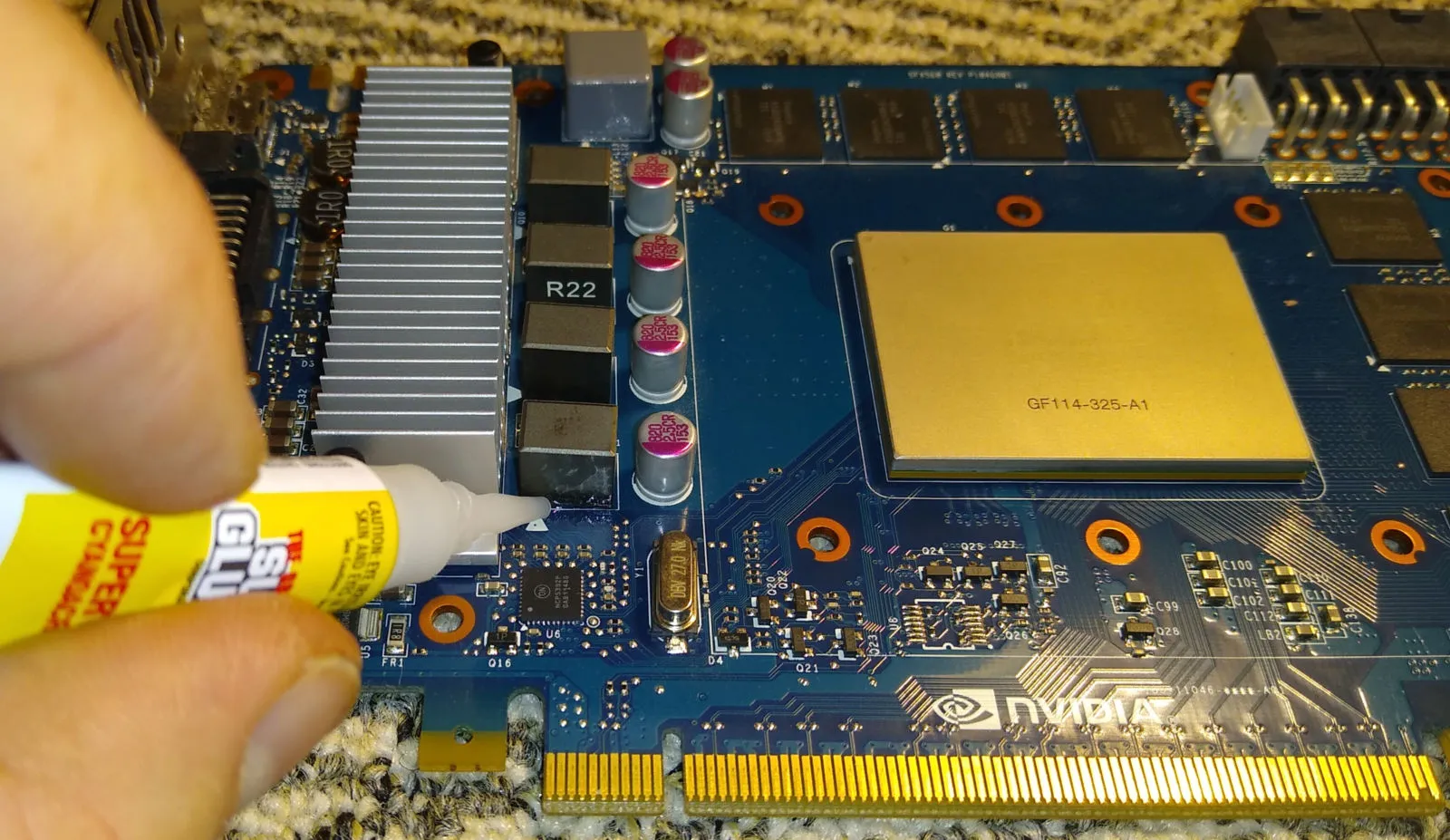 Applying glue to GPU near coil to address coil whine